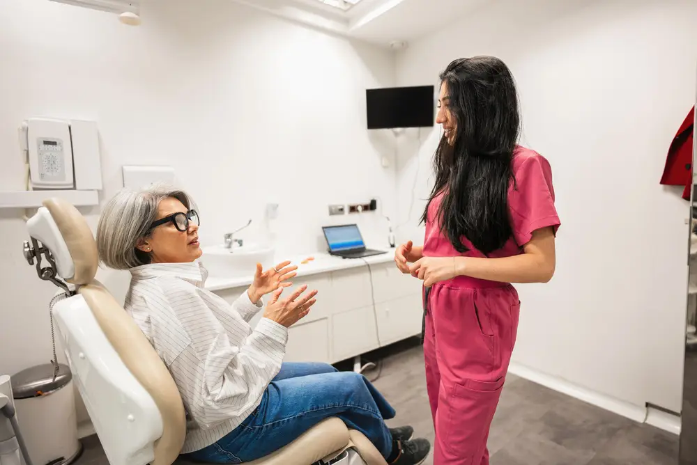 Female patient and female dentist prepping for general anesthesia