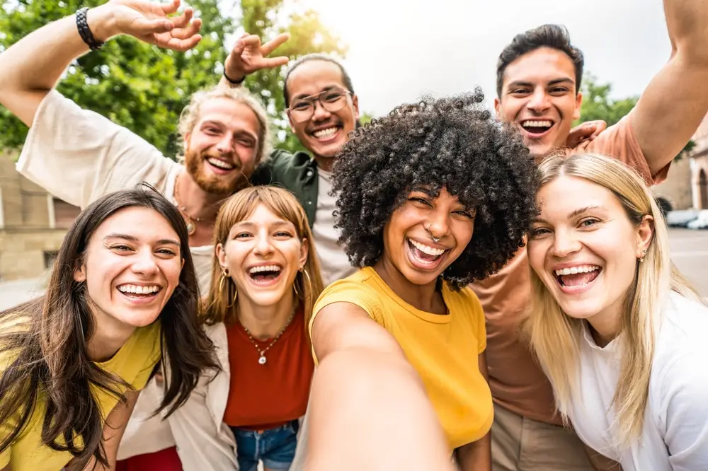 Group of friends outside smiling for a picture