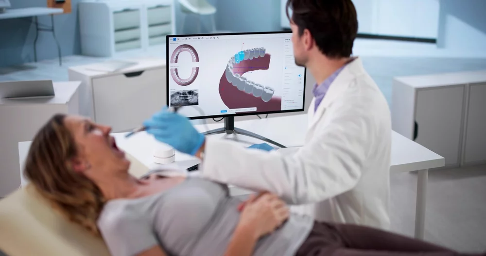 Doctor using a 3D oral scanner for imaging